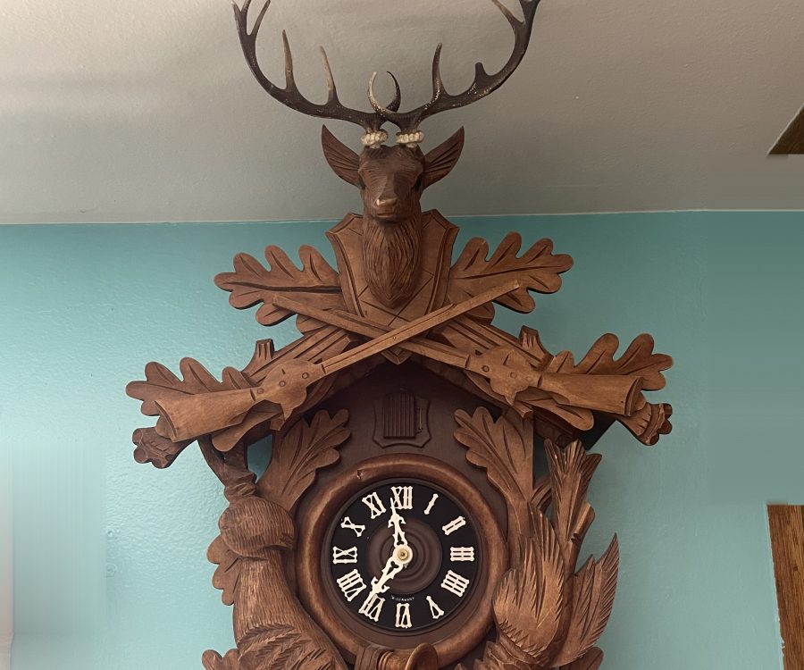 Carved Black Forest cuckoo clock on a wall